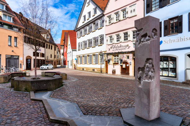 Cityscape and memorial stone in Rottenburg am Neckar, Tübingen Rottenburg, Germany, 03/16/2019: City centre of Rottenburg with memorial stone to commemorate the Jewish history in Rottenburg rottenburg am neckar stock pictures, royalty-free photos & images