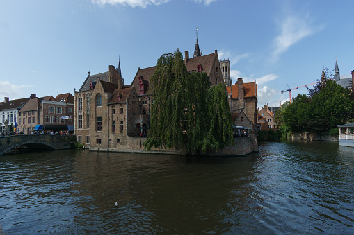 Cityscape of houses with canal of water at Rozenhoedkaai, Bruges, Belgium