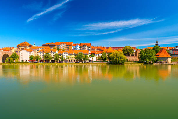 Cityscape of Maribor reflected in the water, Slovenia stock photo