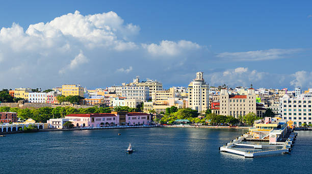 A cityscape of San Juan from the harbor Skyline of San Juan, Puerto Rico puerto rico stock pictures, royalty-free photos & images