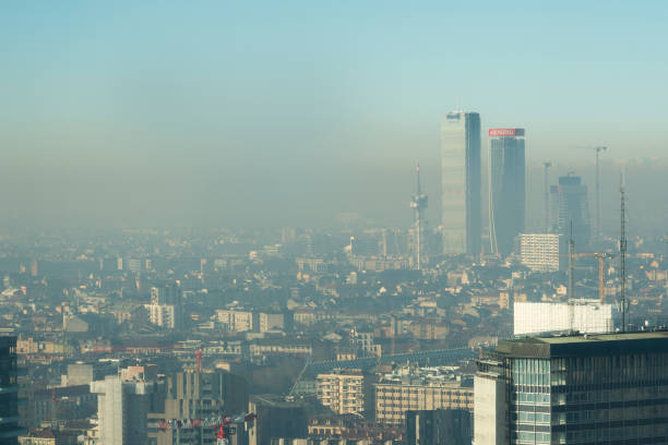 Cityscape with smog Milan, Italy - January 6, 2019: Milan landscape with smog, aerial view of the city with polluted air. smog stock pictures, royalty-free photos & images