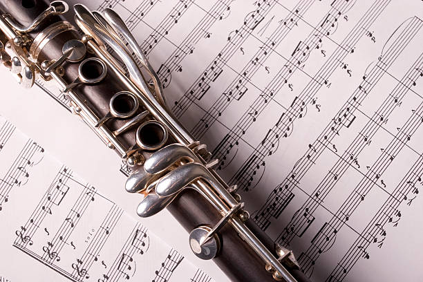 Clarinet isolated over sheet music stock photo
