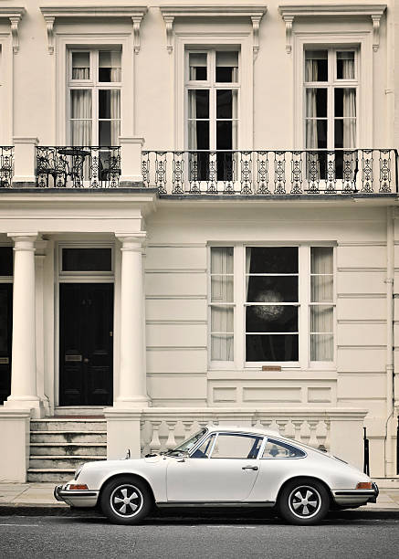 Classic 1960's Porsche 911 parked in front of a house London, United Kingdom - November 03, 2013: classic 1960's white Porsche 911,  parked in front of a typical London house porsche 911 stock pictures, royalty-free photos & images