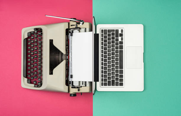 Classic analog typewriter vs Modern digital hi-tech laptop computer Modern Laptop Computer with Antique Typewriter old vs new stock pictures, royalty-free photos & images