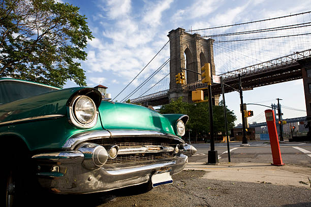 Classic car with view of Brooklyn Bridge stock photo