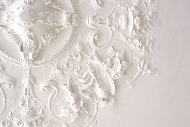 Classic Ceiling Ceiling part in rich stucco decor. Used to be decor element for a light fixture or luster. moulding trim stock pictures, royalty-free photos & images