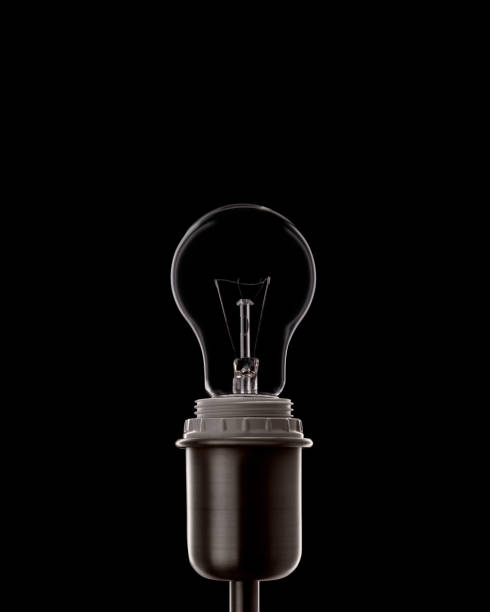 Classic electric lightbulb in the socket stock photo