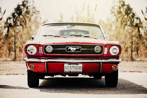 Classic Ford Mustang convertible parked outdoors. Vintage filter. stock photo