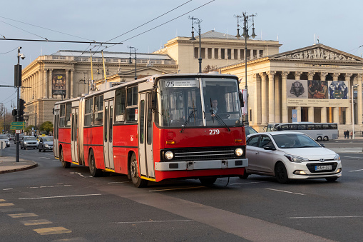 Budapest, Hungary - 17th November, 2021: Articulated trolleybus Ikarus 280T driving on a street. The Ikarus 280 was the one of the most popular trolleybuses and buses in the Eastern Europe in 80. and 90.