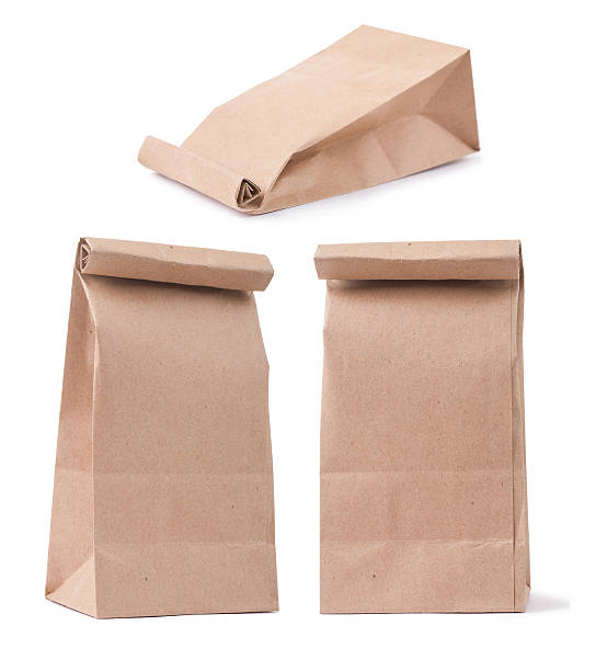 classical brown paper bag in three different foreshortenings isolated - brown paper bag bildbanksfoton och bilder