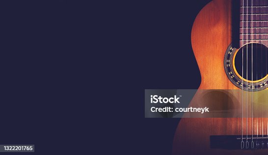 istock Classical Guitar on a dark wood background. 1322201765