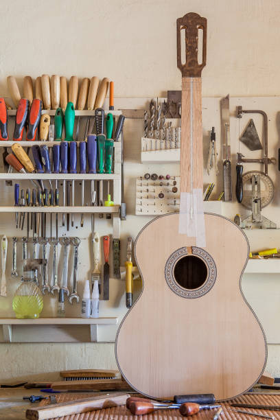 Classical guitar under construction in luthier workshop Classical guitar under construction in luthier workshop oficina stock pictures, royalty-free photos & images