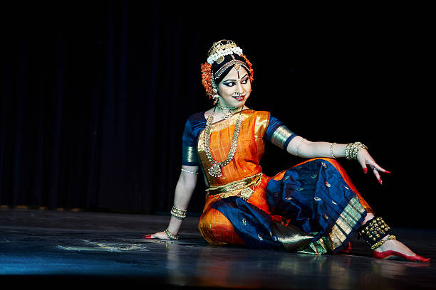 Classical Indian Kuchipudi Dancer giving stage performance Classical Indian Kuchipudi Dancer giving stage performance kuchipudi stock pictures, royalty-free photos & images