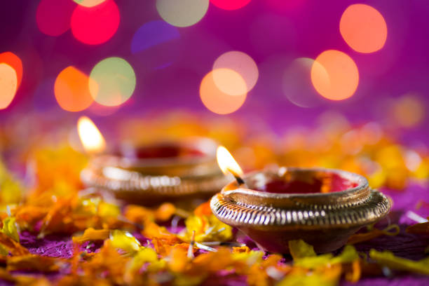 Clay diya lamps lit during Diwali Celebration. Greetings Card Design Indian Hindu Light Festival called Diwali stock photo