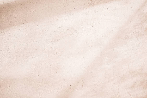 Clay eco-plaster texture. Sunny spring and summer rustic background stock photo