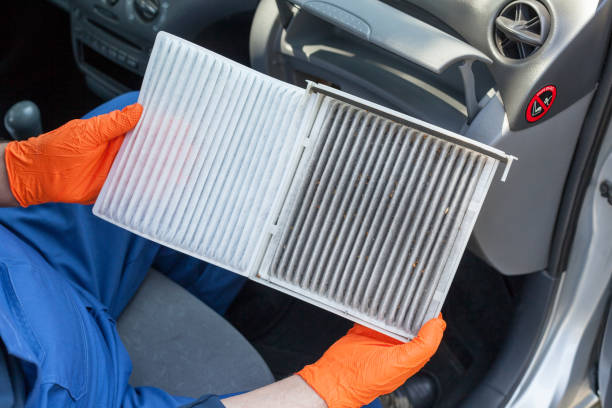 Clean and dirty cabin pollen air filter for a car Replacing an old car cabin air filter filtration stock pictures, royalty-free photos & images