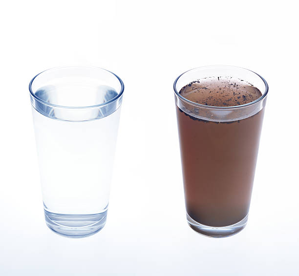 Clean and dirty water in drinking glass - concept Clean and dirty water in drinking glass - concept unhygienic stock pictures, royalty-free photos & images