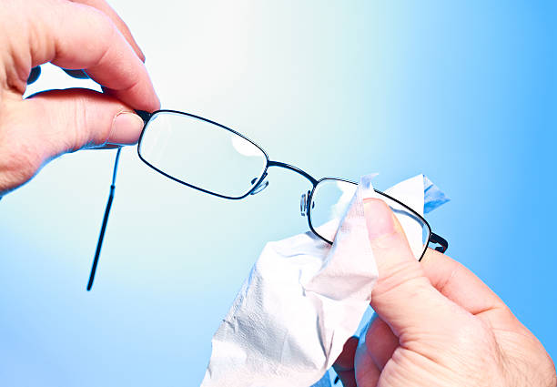 Clean his glasses; stock photo