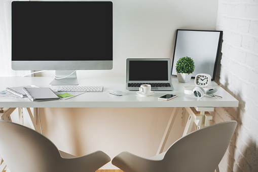 Clean Office Desk With Computer And Laptop Stock Photo Download