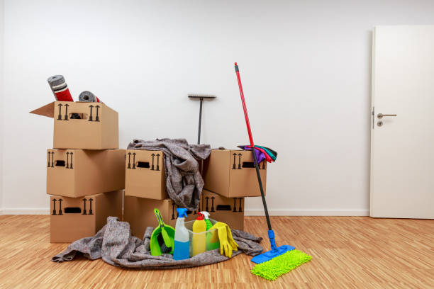 Clean, white room with cartons and cleaning tools stock photo