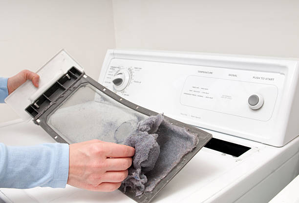 Cleaning Lint Trap Cleaning the clothes dryer lint trap.  Please see my portfolio for other home improvement images. dryer photos stock pictures, royalty-free photos & images
