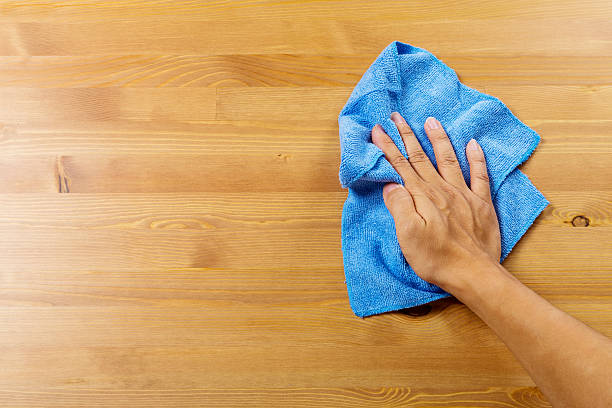 Cleaning table by hand stock photo