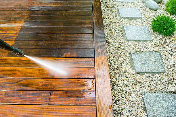 cleaning terrace with a pressure washer stock photo