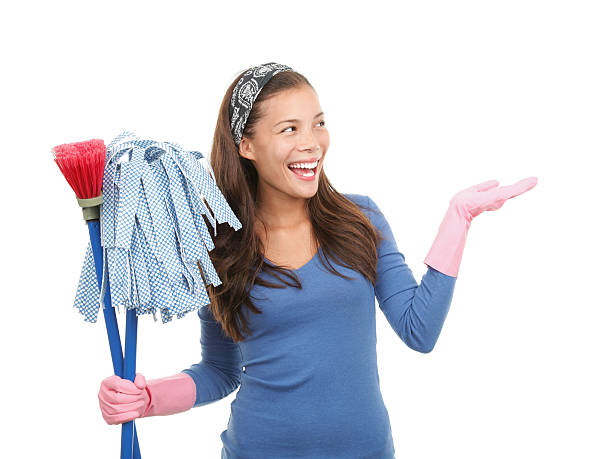 Cleaning woman showing copy space stock photo