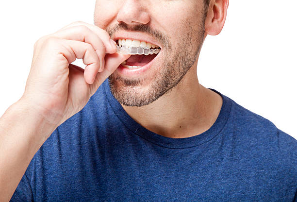 Young man wearing clear braces. 