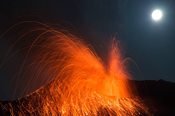 clear full moon volcano eruption stock photo