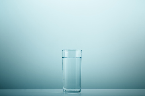 Clear glass of drinking water on a white background