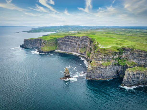 Cliffs of Moher Aerial View Ireland Wild Atlantic Way Scenic aerial view towards the famous Cliffs of Moher Coastline under beaitiful summer sky. Drone Point of View. Burren Region, County Clare, Ireland, Europe cliffs of moher stock pictures, royalty-free photos & images