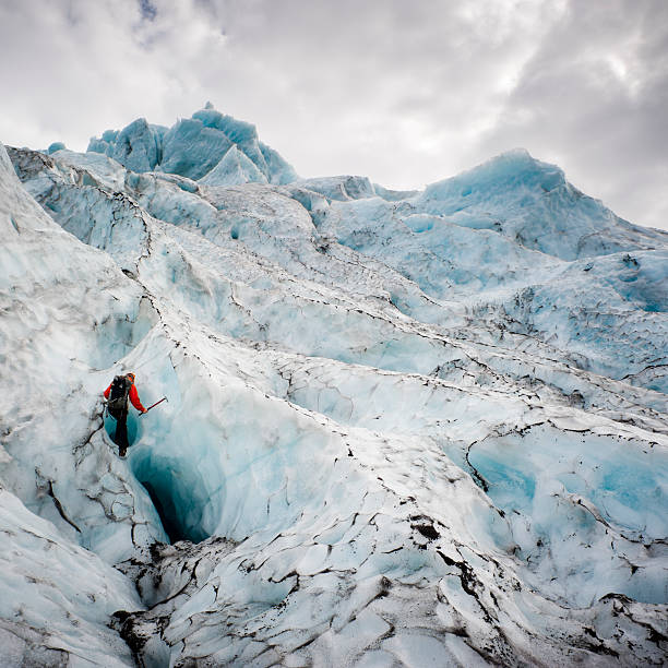 climbing a glacier stock photo