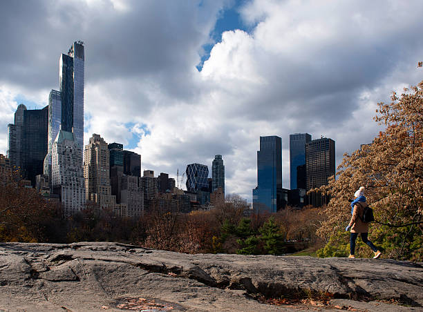 Climbing a rock in Central Park, New York stock photo