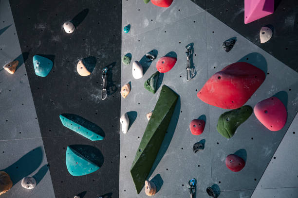 Climbing Equipment On An Indoor Climbing Wall. No People. Detail View Of Colorful Indoor Climbing Wall. stock photo