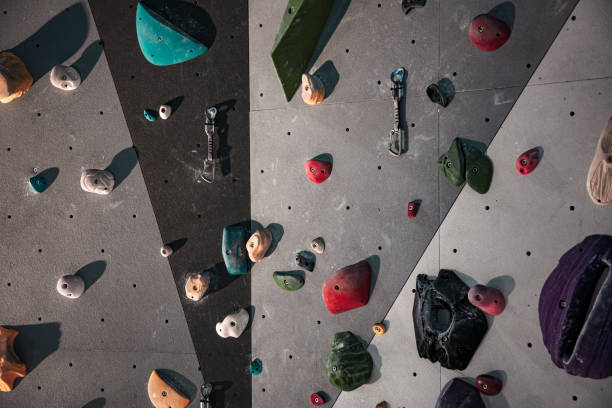 Climbing Equipment On An Indoor Climbing Wall. No People. Detail View Of Colorful Indoor Climbing Wall stock photo