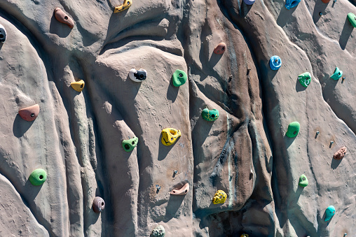 climbing wall with colored grips