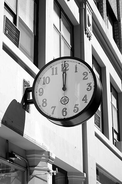Clock displays noon stock photo