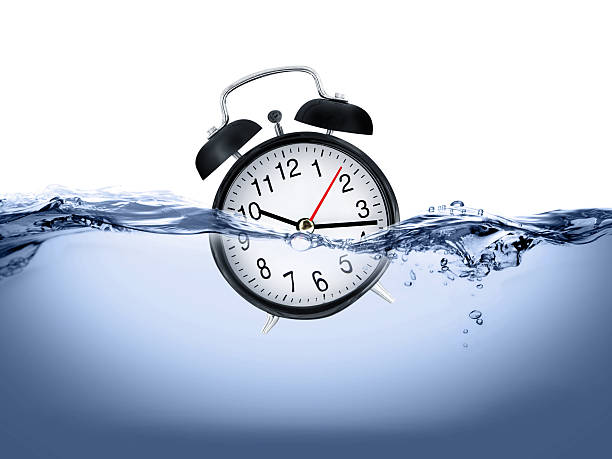 Clock in water stock photo