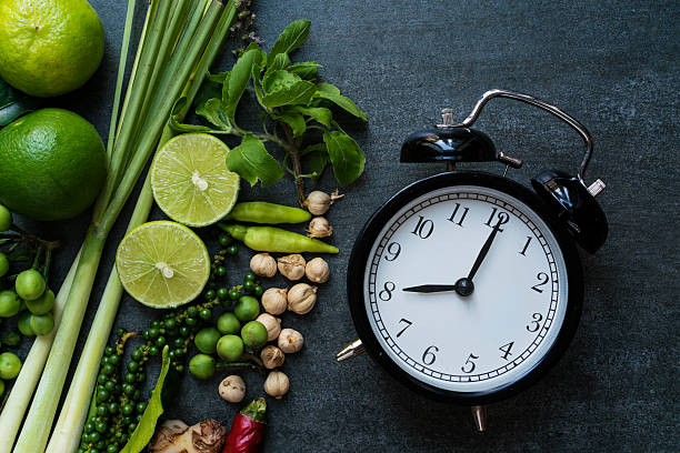 Clock on table prepare for cooking stock photo