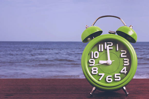 Clock on Wooden Floor with Blue Sea Background , Vintage Style