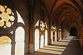 istock Cloister Corridor with light and shadow 185089769