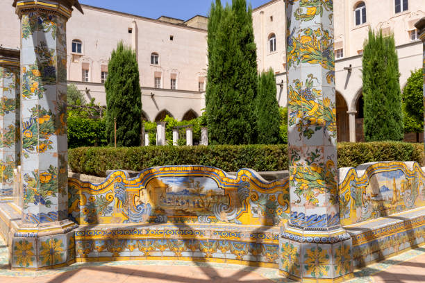 Cloister Santa Chiara with octagonal columns decorated with majolica tiles in rococo style, Naples, Italy stock photo