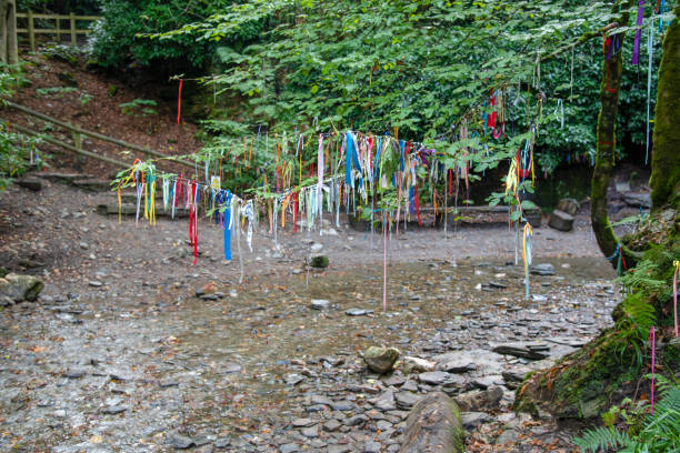 Clootie tree in Cornwall Clootie Tree at St Nectans Glenn near Tintagel in north Cornwall. Clootie Wells are places of pilgrimage in Celtic areas. Strips of cloth or rags are usually tied to a branch as part of a healing ritual. thomas wells stock pictures, royalty-free photos & images