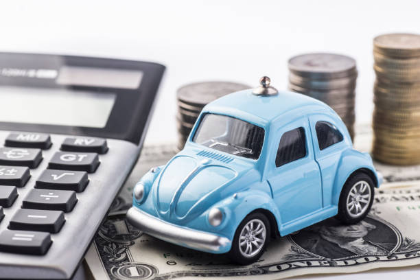 Close up blue car with calculator and coin.Selective focus in car. Concept for car insurance and financial. car loan stock pictures, royalty-free photos & images