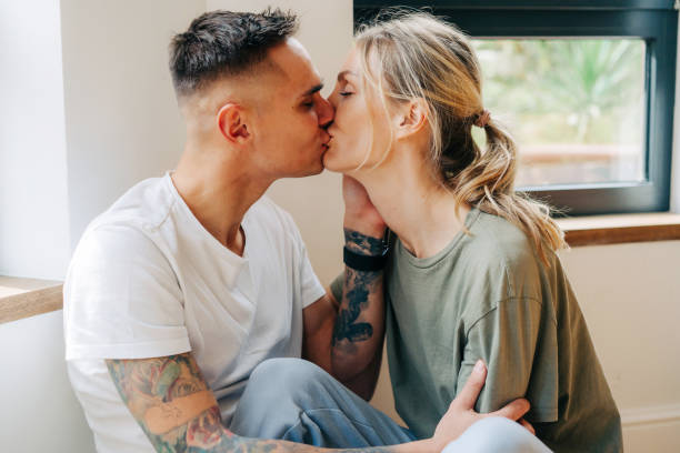 Close up boyfriend and girlfriend kissing stock photo
