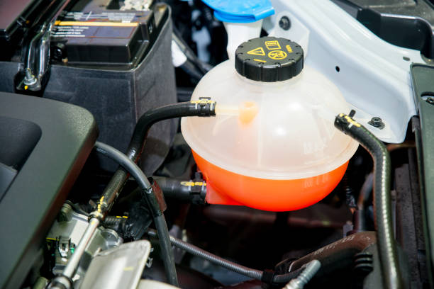 Close up Coolant container in a car's engine bay stock photo