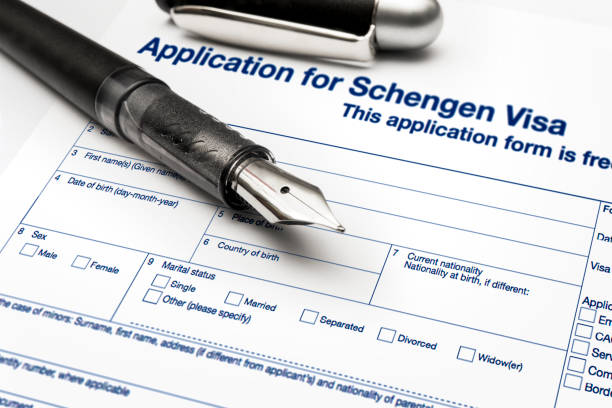 close up from a Application for Schengen visa and passport stock photo