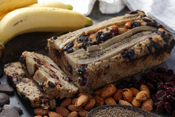 Close up homemade Banana cake with chocolate chip made by almonds flour, put the cranberry and perilla seed, no sugar for low carbohydrate diet. Healthy foods or Low-Carb Diet concept. stock photo