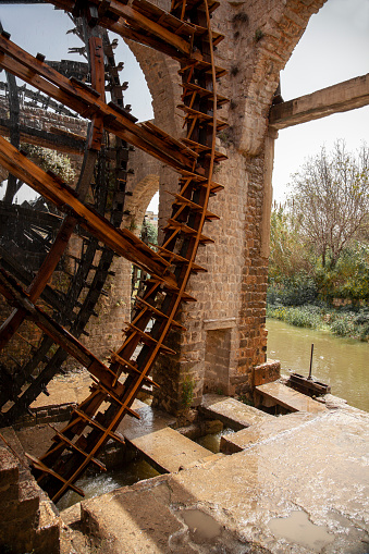 Close up image of historic water wheels in Hama, Syria These are large mechanical wooden wheels called norias. They take water from orontes river and canalise it to irrigation.